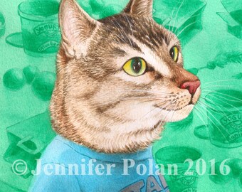 May include: A tabby cat wearing a blue t-shirt with the words "Star Wars" printed on it. The cat is looking to the right and has a green background with various objects, including yogurt containers and stars.