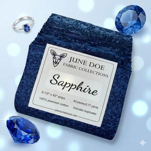 May include: A stack of blue fabric strips with a white label that reads "Sapphire" from "June Doe Fabric Collections." The image also features a sapphire ring and two faceted blue gemstones. The fabric is 2-1/2" x 42" strips.