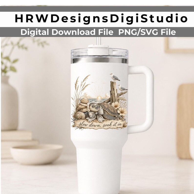 May include: A white insulated tumbler with a handle and clear lid featuring a printed graphic of a sea turtle, seashells, seagulls, and tall grass on a beach at sunrise with the text "slow down, soak it in" written in a cursive script font.