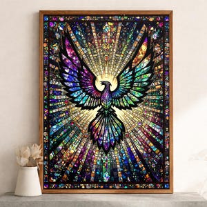 May include: A framed stained glass art piece featuring a phoenix with outstretched wings. The artwork showcases a vibrant array of colors, including blues, greens, purples, and yellows, creating a radiant and detailed design. The frame is made of wood.