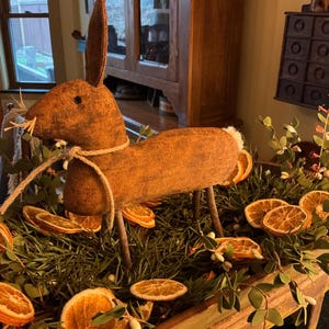 Primitive grungy aged standing rabbit with sheep’s wool cotton tail.