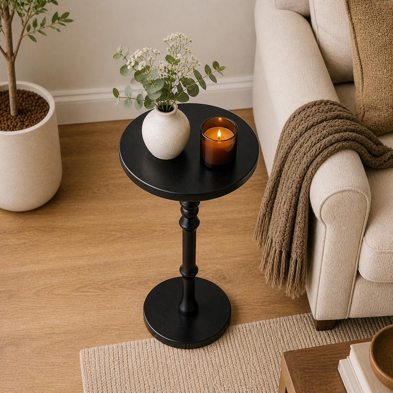 top view of small round side table with decor in small space living room