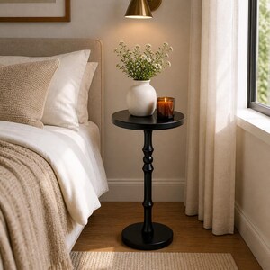 bedside table for small bedroom with minimalist black pedestal design