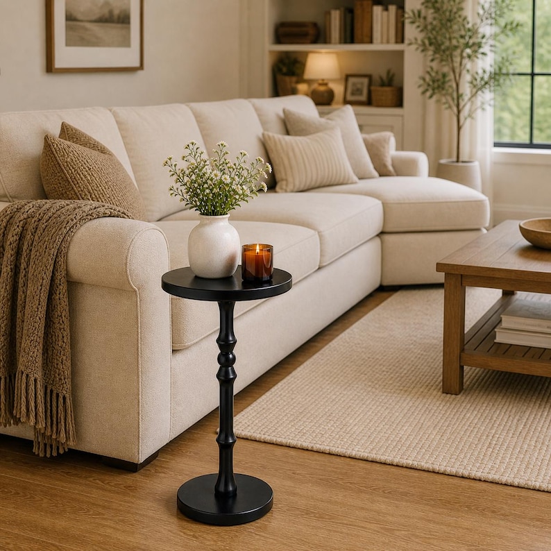 small side table styled next to sofa in modern minimalist living room