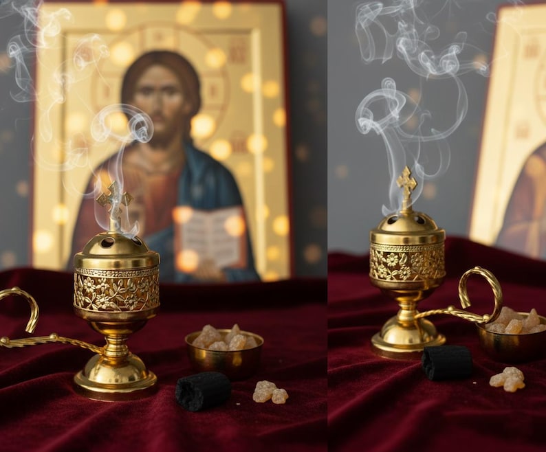 May include: A gold-colored censer with intricate floral designs, emitting wisps of smoke. The censer is set on a deep red velvet surface, accompanied by a small bowl of incense and charcoal. A religious icon is in the background.