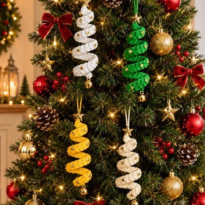 May include: Four spiral-shaped Christmas tree ornaments made of crocheted yarn in white, green, yellow, and cream. Each ornament features a small gold star at the top, tiny gold beads along the spiral, and a small gold bell at the bottom.