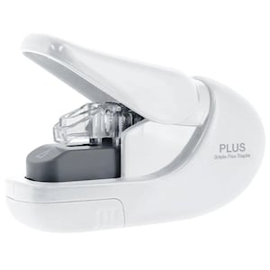 May include: A white staple-free stapler with a curved, ergonomic design. The device features a hinged top lever, a dark gray internal punching mechanism, and the text PLUS Staple-Free Stapler printed in gray on the side of the white plastic body.
