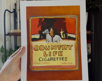 May include: A rectangular art print featuring a vintage-style illustration of a person riding a white horse. The text reads Player's Country Life Cigarettes, Cork Tipped, Virginia. The design uses warm orange, yellow, and brown tones.