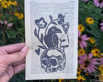 Crow Skull Linocut Print: Botanical Gothic Art on Vintage Dictionary Page