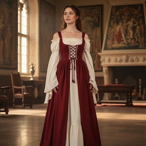 May include: A medieval-style dress featuring a burgundy bodice with a laced front and a long, flowing skirt. The dress has off-the-shoulder sleeves and a white underdress. The setting is a grand hall with ornate decor.