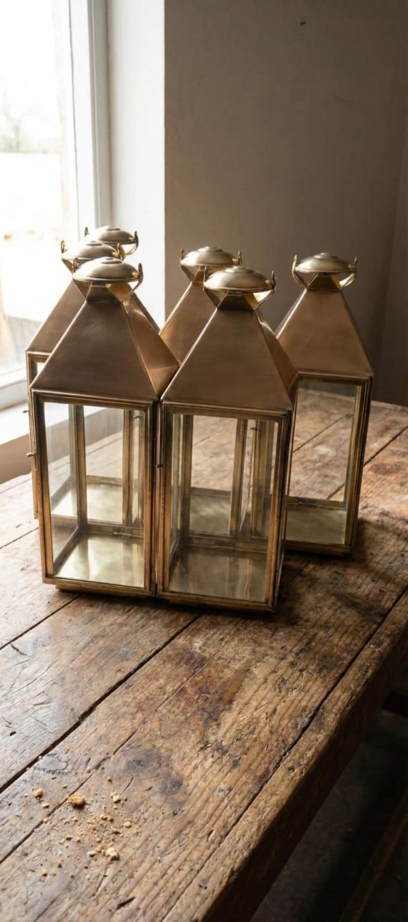 Handmade solid brass lantern candle holder with clear glass panels and polished brass finish