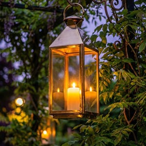 Handmade solid brass lantern candle holder with clear glass panels and polished brass finish