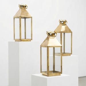 Handmade solid brass lantern candle holder with clear glass panels and polished brass finish