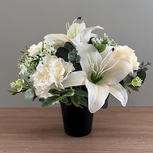 May include: A trio of ceramic mugs with a speckled, matte finish in cream, light grey, and dark grey. Each mug features a simple, minimalist design, ideal for tea or coffee.