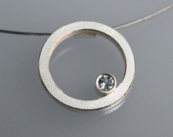 Contemporary handmade  silver pendant "Q " with blue topaz