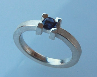 Stacking ring in silver with 5mm iolite gemstone .