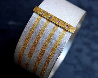 Sterling silver bracelet with 24kt gold kum boo and 4 diamonds