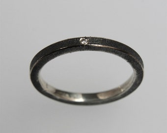 Minimalistic contemporary stacking ring in oxidized silver with diamond