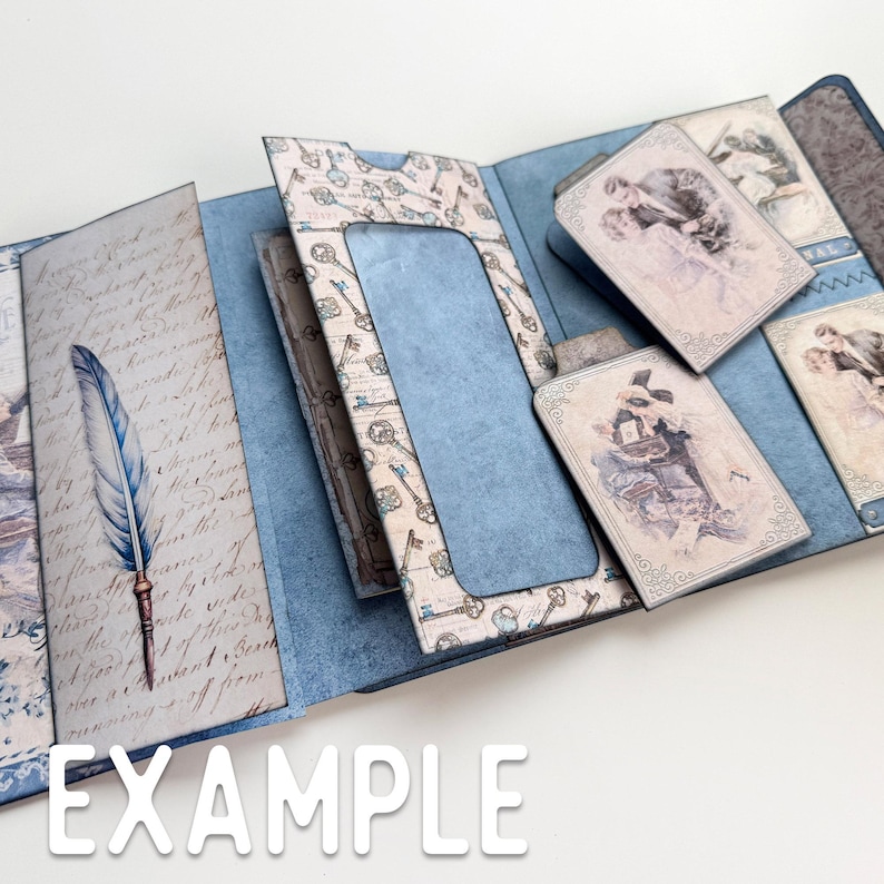 May include: A blue and white scrapbook with a key pattern and a window for a photo. The scrapbook has several pockets for holding photos and other memorabilia. The scrapbook is open to reveal the inside pages.