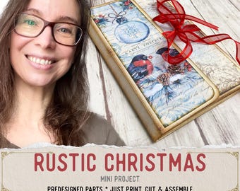 May include: A rectangular paper craft project featuring a vintage-style Christmas design with a blue ornament, a bullfinch bird, pinecones, and script text. The project is tied with a red sheer ribbon and has a distressed, aged paper edge finish.