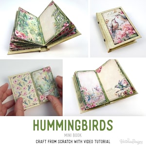 May include: A miniature book with a hummingbird theme. The cover and pages feature floral and bird illustrations in shades of pink, green, and beige. The book is open in several views, showcasing the detailed artwork and design.
