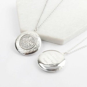 May include: Silver locket necklace featuring a vintage coin design. The locket is engraved with the text "Happy 50th Birthday A New Chapter Begins".