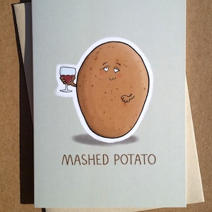 Op de afbeelding: Een kaart met een cartoonillustratie van een aardappel die een glas wijn vasthoudt. De tekst "MASHED POTATO" staat onder de aardappel.