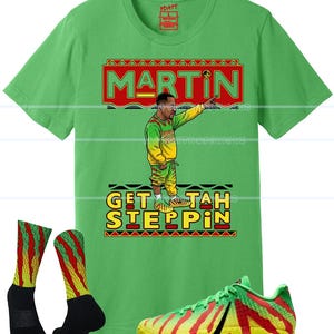 May include: Green t-shirt with a graphic of a man pointing, the word "MARTIN", and the phrase "GET TAH STEPPIN". The image also includes matching socks and sneakers with a red, yellow, and green design.