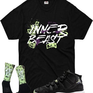 May include: Black t-shirt with the text "INNER BEAST" in white, green, and purple. The image also includes black and green socks with a pattern, and black and grey sneakers with a green sole.