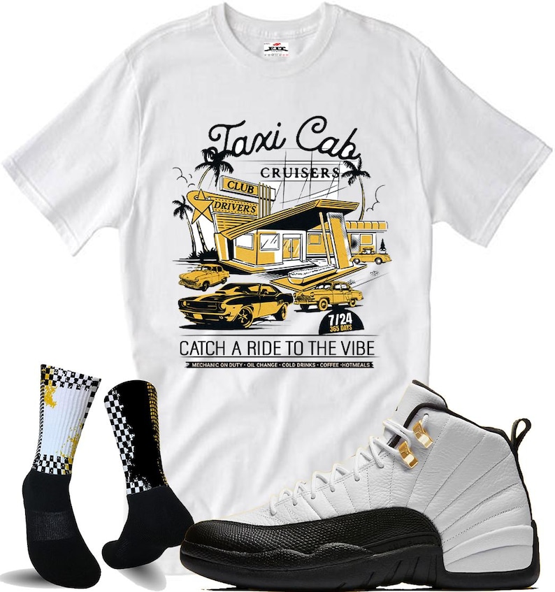 May include: A white t-shirt with a Taxi Cab Cruisers graphic, black and white checkered socks, and white and black sneakers. The shirt features a retro design with cars and the text "Catch a Ride to the Vibe."