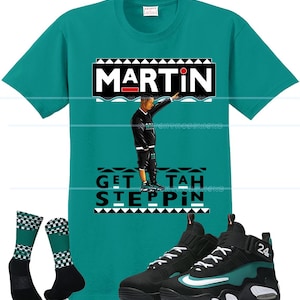 May include: Teal t-shirt with a graphic of a man and the word "MARTIN". The shirt is paired with black and teal sneakers, and checkered socks. The text "GET TAH STEPPIN" is also on the shirt.