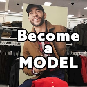 Op de afbeelding: Een poster met de tekst "Become a MODEL" in dikke witte letters. De poster toont een lachende man in een bruine jas, een geruit overhemd en een zwarte pet. Kledingrekken zijn zichtbaar op de achtergrond.