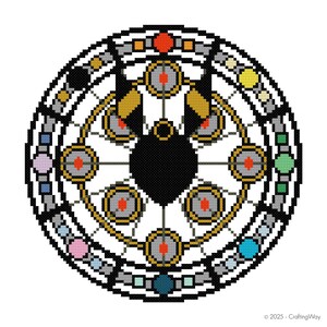 May include: A circular cross-stitch pattern with a black central motif, encircled by gold, grey, and colourful geometric shapes. The design incorporates multiple circular elements with red centres, set against a white backdrop. The text "© 2025 - CraftingWay" is in the bottom right corner.