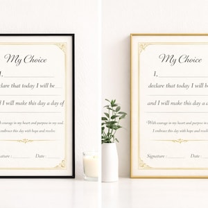 May include: Two framed prints with the text "My Choice" in elegant script. One frame is black, the other gold. The text includes prompts to fill in personal affirmations, with space for a signature and date. Decorative floral accents adorn the corners.