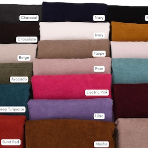 May include: A collection of folded fabric samples in various colors, including charcoal, navy, and midnight black. Other colors include ivory, mustard, chocolate, taupe, cream, beige, rose, avocado, aqua, electric pink, deep turquoise, burgundy, lilac, burnt red, almond, and mocha.