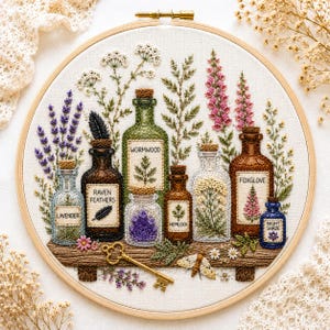 May include: An embroidery hoop containing a fabric panel with stitched apothecary bottles labelled Lavender, Raven Feathers, Wormwood, Hemlock, Foxglove, and Night Shade. The design includes botanical sprigs, a gold key, and a moth on a wooden shelf.