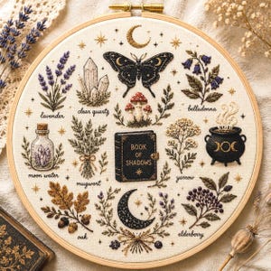 May include: A circular embroidery hoop featuring a cream fabric background with stitched illustrations of a black moth, a Book of Shadows, a cauldron, crystals, and various plants including lavender, belladonna, mugwort, yarrow, oak, and elderberry.