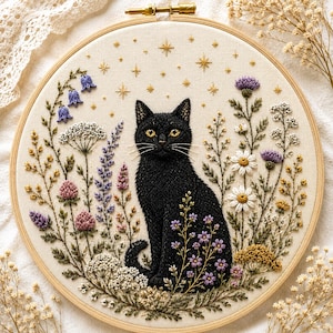 May include: A circular embroidery hoop containing a hand-stitched design of a black cat sitting amidst a variety of colorful wildflowers and green foliage. The background fabric is off-white and features embroidered gold stars above the cat.
