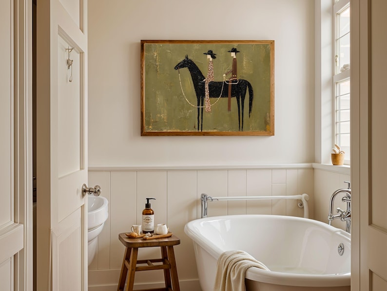 May include: A rectangular framed wall art piece featuring a stylized painting of a black horse with two riders in hats. The background is a muted olive green. The riders are depicted in a simplified, linear fashion, one wearing a patterned garment.