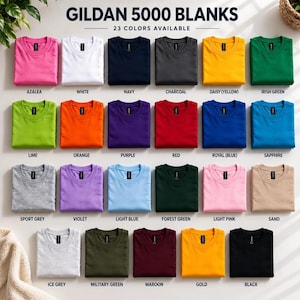 May include: A collection of Gildan 5000 blank t-shirts displayed in a grid, featuring 23 distinct color options including azalea, white, navy, charcoal, daisy, irish green, lime, orange, purple, red, royal, sapphire, sport grey, violet, light blue, forest green, light pink, sand, ice grey, military green, maroon, gold, and black.