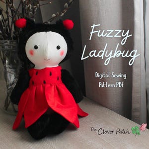 May include: A plush ladybug doll with a white face, black fuzzy body, and red dress featuring black spots. The doll has red antennae and pink cheeks. Text on the image reads: Fuzzy Ladybug, Digital Sewing Pattern PDF, The Clover Patch.