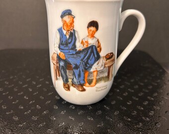 Taza vintage de Norman Rockwell con la imagen de "La hija del farero".