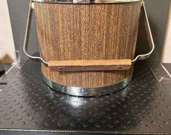 vintage Mid-Century Modern Kromex ice bucket featuring a faux wood grain body