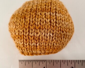 Hand knitted Hexipuffs