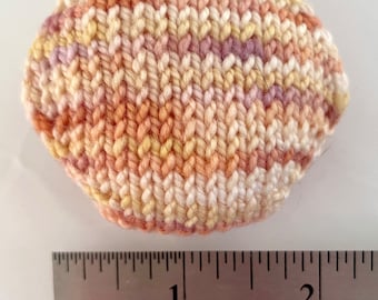 Hand knitted Hexipuffs