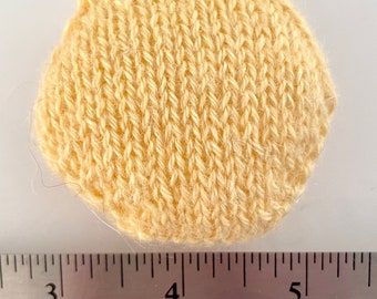 Hand knitted Hexipuffs