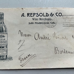May include: Antique envelope from A. Repsold & Co., Wine Merchants, San Francisco, 1895, addressed to Bordeaux, France. Features a detailed illustration of a Cognac bottle and handwritten script.