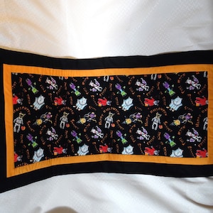 Halloween Trick or Treaters Quilted Table-runner with a black and Orange