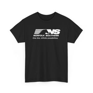 May include: Black t-shirt with a white logo featuring the letters "NS" and a horse silhouette. The text "NORFOLK SOUTHERN" and "One line, infinite possibilities." are below the logo. The shirt is made of a soft material.