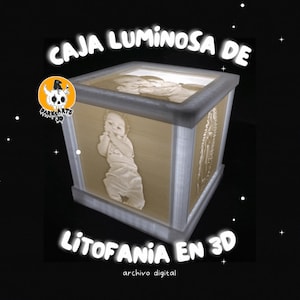 May include: A square, illuminated box with a baby's image on the front and top. The box is beige with a gray frame and features the text "CAJA LUMINOSA DE" and "LITOFANIA EN 3D". The box is a digital file.